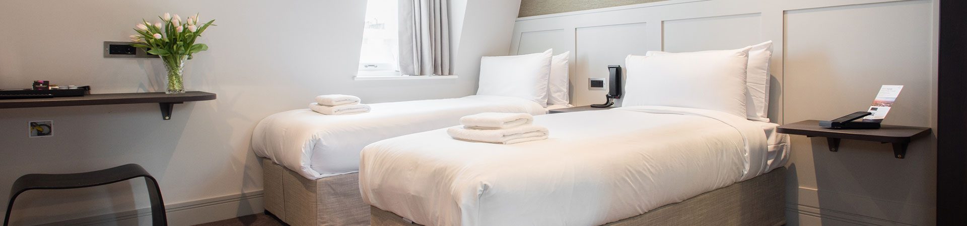 Twin hotel room with two single beds and stylish interior |Mowbray Court Hotel Earls Court