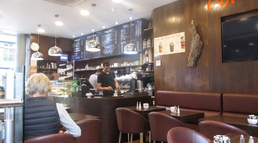 Coffee shop with barista and seating area | Mowbray court hotel